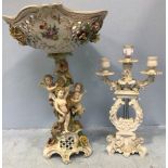 Two late 19th/early 20th century flower encrusted German porcelain compositions, to include a