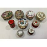 Nine assorted enamel pill boxes, eight by Halcyon Days, with various decoration including