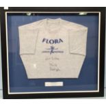 A mounted and framed Flora London Marathon grey t-shirt, signed by Paula Radcliffe, measures 63cm