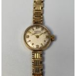 A 9ct gold ladies Vertex Revue wristwatch, the silvered dial with batons denoting hours and Arabic