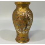 A Japanese Satsuma pottery small baluster vase, with painted and heavily tooled-gilt decoration of
