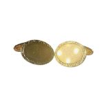 A pair of 9ct yellow gold oval shaped cufflinks, with patterned edges, weighing 8.0 grams.