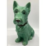 A large green-glazed Sylvac pottery seated terrier