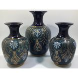 A garniture of three Lovatt & Lovatt period Langley Ware Art Pottery vases, of ovoid form with