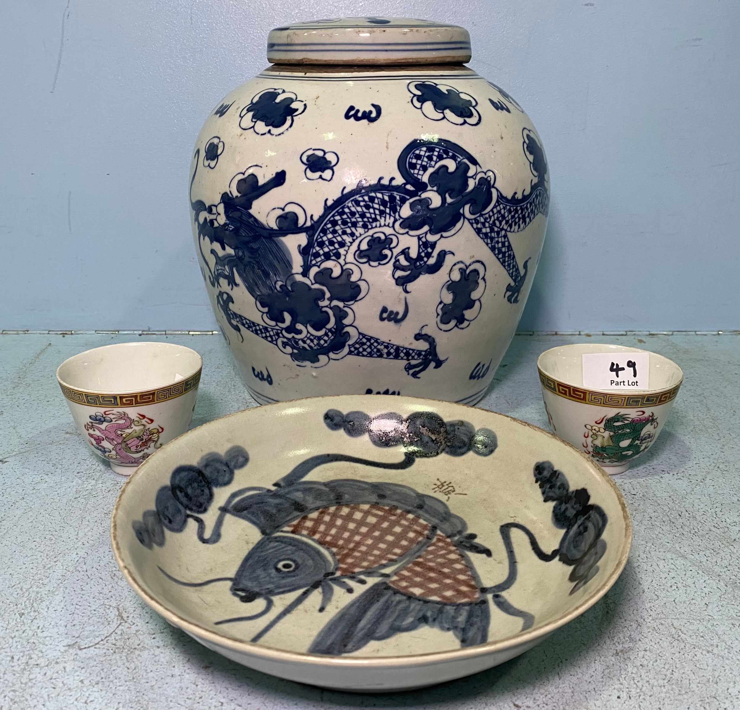 A large Chinese porcelain ginger jar and cover painted in underglaze cobalt blue with dragons amidst