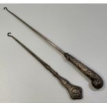 Two silver-handled button hooks, one by William Hutton & Sons, London, 1890, the other an Art