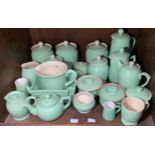 A quantity of Langley Mill pottery 'Creamline' kitchen wares in 'Court Green,' including tea and