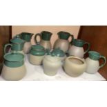 Eleven Lovatt & Lovatt Pottery green 'Myrtle' domestic wares comprising jugs, jars and covers