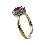 A 9ct yellow gold ruby and diamond cluster dress ring, ring weighs 2.2 grams, finger size M.