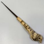 A buttonhook with carved antler handle, the handle ornately worked with crabs and toads on a