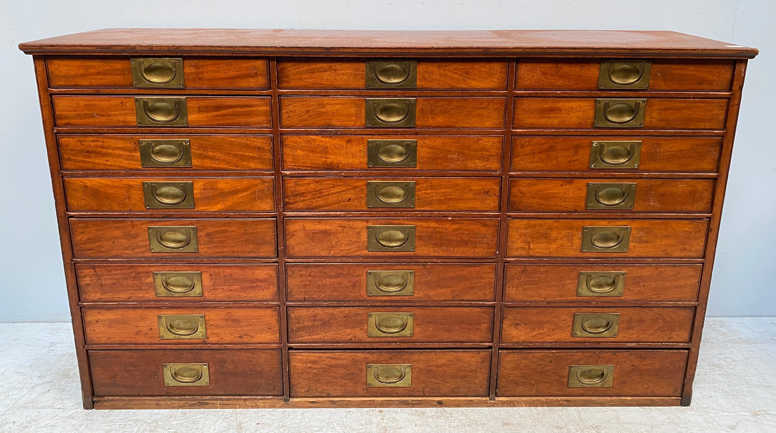 A 19th Century walnut collector’s chest of drawers, comprising three banks of eight graduated