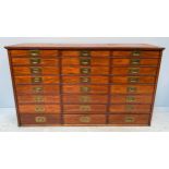 A 19th Century walnut collector’s chest of drawers, comprising three banks of eight graduated