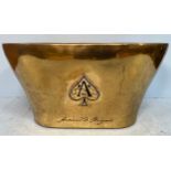 A brass champagne/wine cooler, inscribed Armand de Brignac with applied ‘Ace of Spades’ logos to