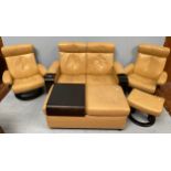 A Norwegian Ekornes Stressless suite in pale yellow leather comprising a pair of reclining armchairs