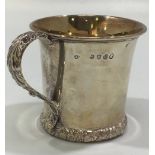 A George III silver christening mug, of flared cylindrical form with acanthus-leaf cast and