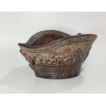 A Chinese carved horn libation cup, 8cm high