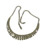 A 9ct yellow gold flat fringe link necklace, 16.5’’, weighing 10.7 grams.