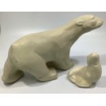 Two various Langley Pottery cream-glazed polar bears, c1931-39, designed by Frederick Braddon,