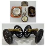 A pair of brass and iron table-top cannons, together with continental silver pocket watch, ladies