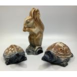Two various Langley Pottery tortoises and a squirrel, with brown and blues glazes, 1931-39, designed