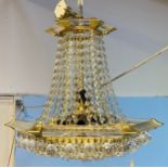 A chandelier of hexagonal baluster form with cut glass droplets suspended from plastic supports,