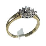 A 9ct yellow gold ring, set with small round diamonds in a cluster design, estimated total weight of