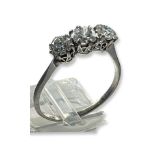 A ladys platinum diamond ring, claw set with three Victorian cut diamonds, estimated total weight of