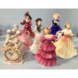 Six hand-painted porcelain figures of ladies, comprising four Royal Doulton Figures of The Year