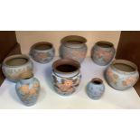 Eight various Calvert & Lovatt period Langley Ware art pottery pots, 'sgraffito flowers' carved,