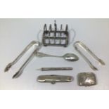 A collection of assorted silver including a small toast rack by George Edward & Sons, hallmarked