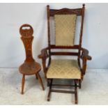 A late 19th/early 20th century American walnut rocking chair, with unusual cradle-swing rocker,