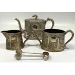 A Chinese Export Silver Three-Piece Silver Teaset by Wang Hing, of tapering oval section, richly