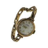 A 9ct gold lady’s Lanco cocktail watch with 9ct gold expanding bracelet, weighing 13.2 grams gross.