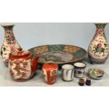 A small collection of assorted Oriental ceramics including a charger, a pair of famille rose vases
