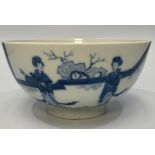 A Chinese porcelain blue and white bowl decorated with ladies in a walled garden with a rabbit,