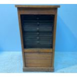 An oak tambour-front filing cabinet, formerly part of a desk, 43cm wide (af)