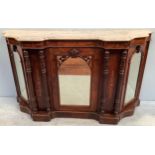 An inlaid walnut credenza with shaped marble top, central and pair of side mirrored doors, pair of
