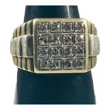 A gents 9ct yellow and white gold dress ring, set with 16 x round diamonds, total diamond weight 1.