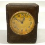 A 1920’s Michelin Electric travel clock, the brass dial with Arabic numerals denoting hours,