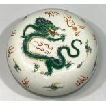 A Chinese Qing Dynasty famille vert porcelain box and cover, of compressed circular form and