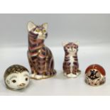 Four Royal Crown Derby paperweights including ‘Aura’ the hedgehog, a ladybird and two cats, all with