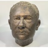 A ‘bronzed’ fibreglass life size sculpture of a gentleman’s head, 26cm high