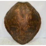 A large 19th century ‘worked’ taxidermy sea turtle shell, carved with lion, elephant, rabbit and