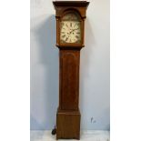 An early 19th century oak longcase clock with 8-day movement striking a bell, caddy top with