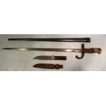 A French 1874 pattern bayonet with triform steel blade marked St Etiennes 1876, wooden and brass