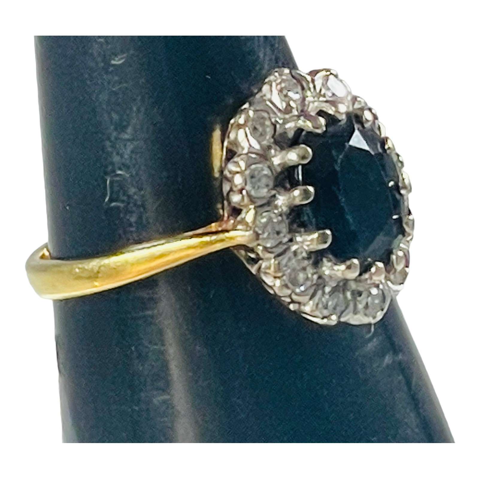 An 18ct yellow gold sapphire and diamond dress ring, set with an oval shaped sapphire to the centre, - Image 5 of 5