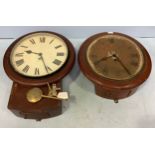 A GPO drop-dial wall clock with white enamel dial and black roman numerals, marked ‘GPO.’ With