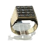 A gents 9ct gold dress ring, set with sixteen old cut diamonds in a square top design, estimated