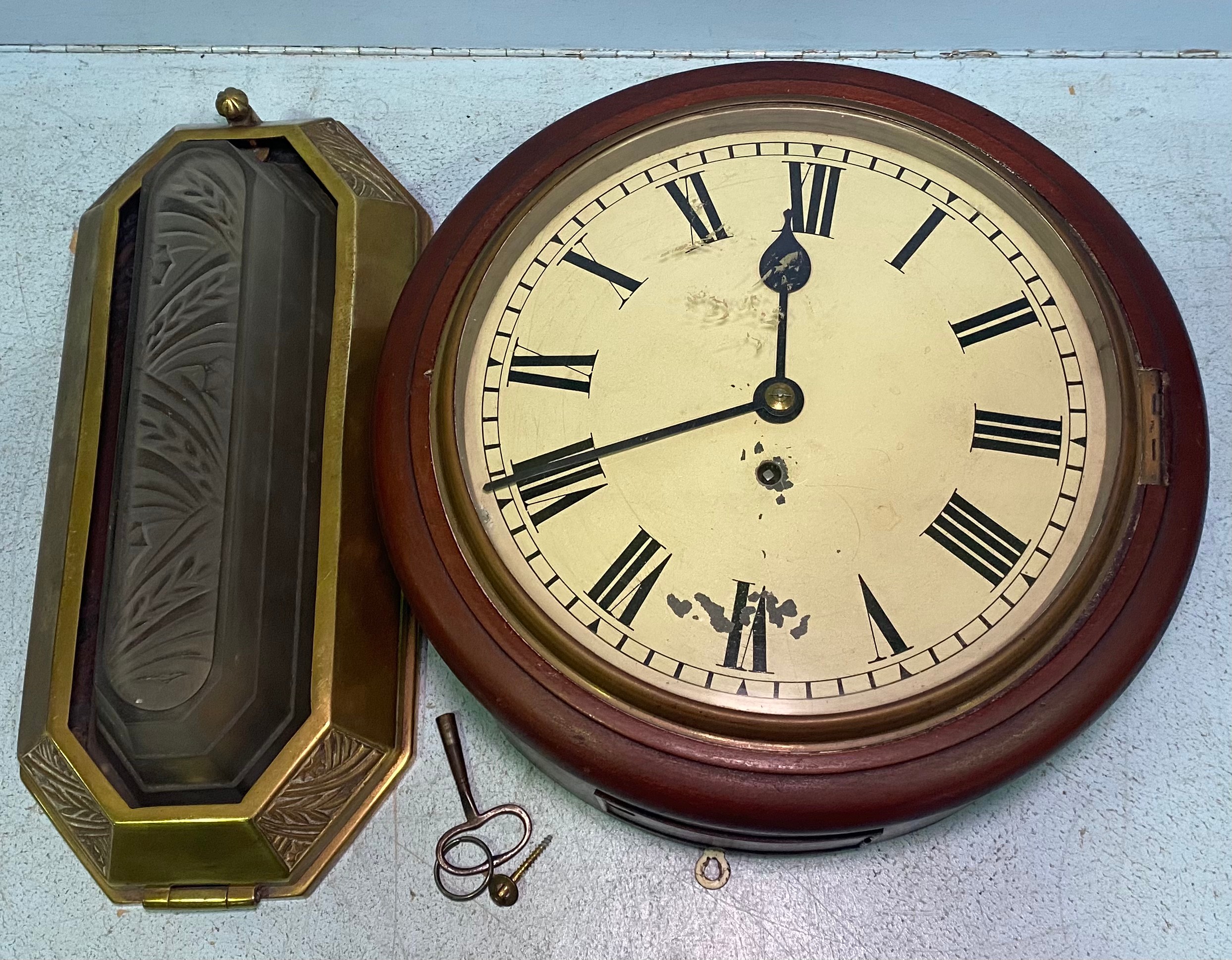 A circular wall clock with cream enamel dial and black Roman numerals, single fusee movement,