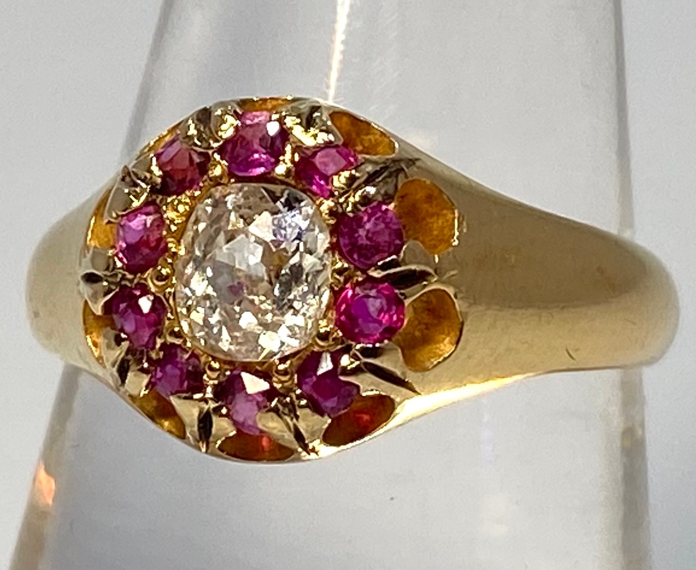 An 18ct yellow gold Victorian ring, set with an oval shaped Victorian cut diamond to the centre,